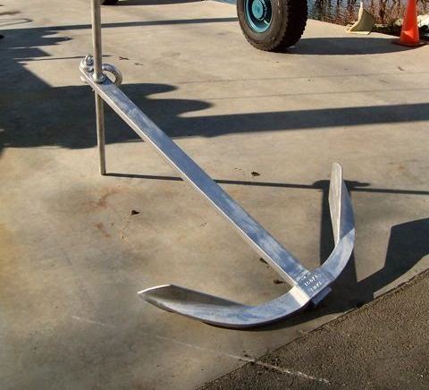 An assembled Luke storm anchor standing on the pavement in the yard.