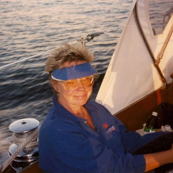 Nora Luke in a visor aboard a boat on the water.