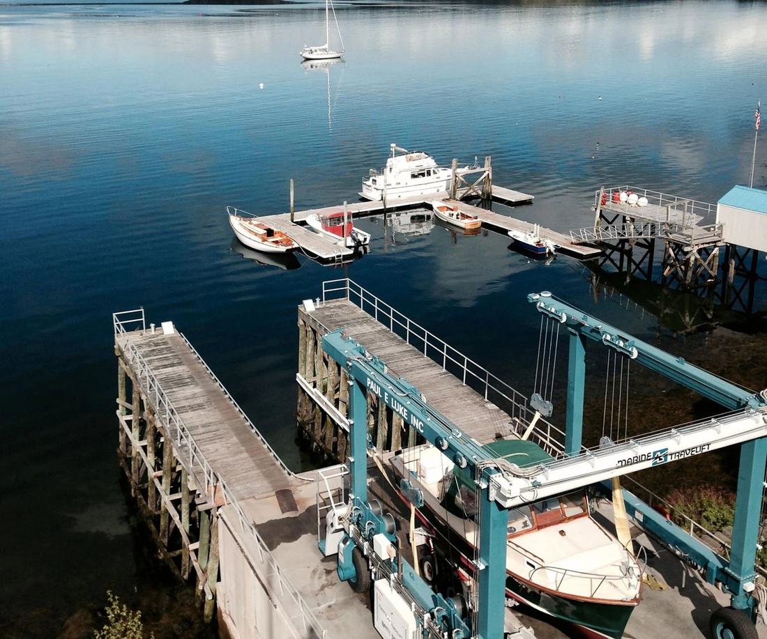 The yard's dock and travel lift bay on Linekin Bay, seen from above.